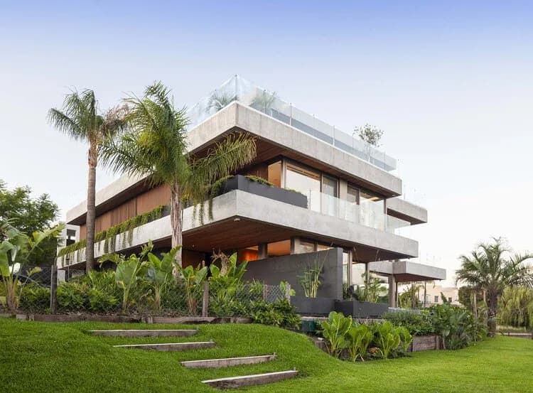 A modern home with a garden at dusk