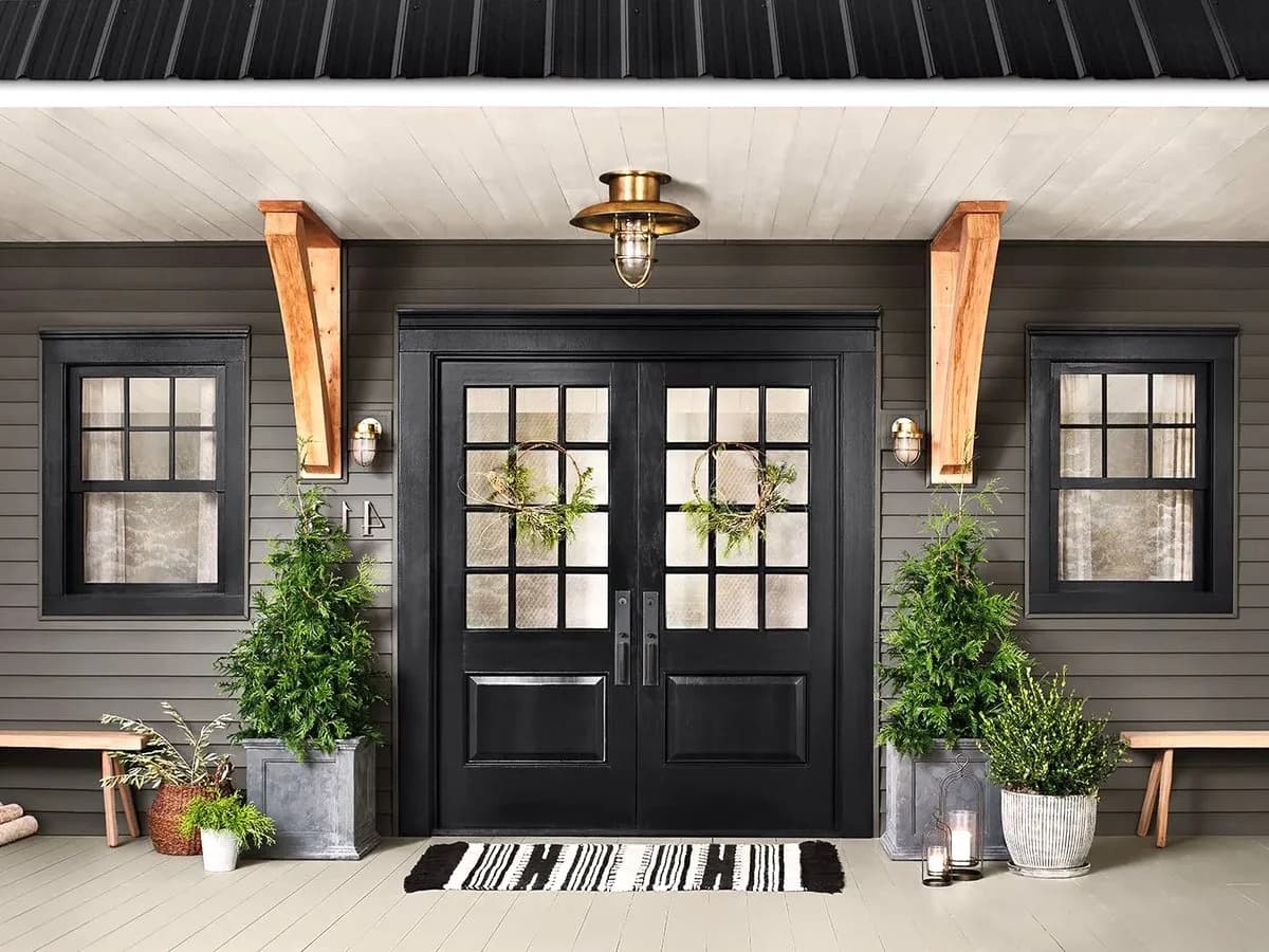 Front elevation — Row house with a garden in Kakkanad